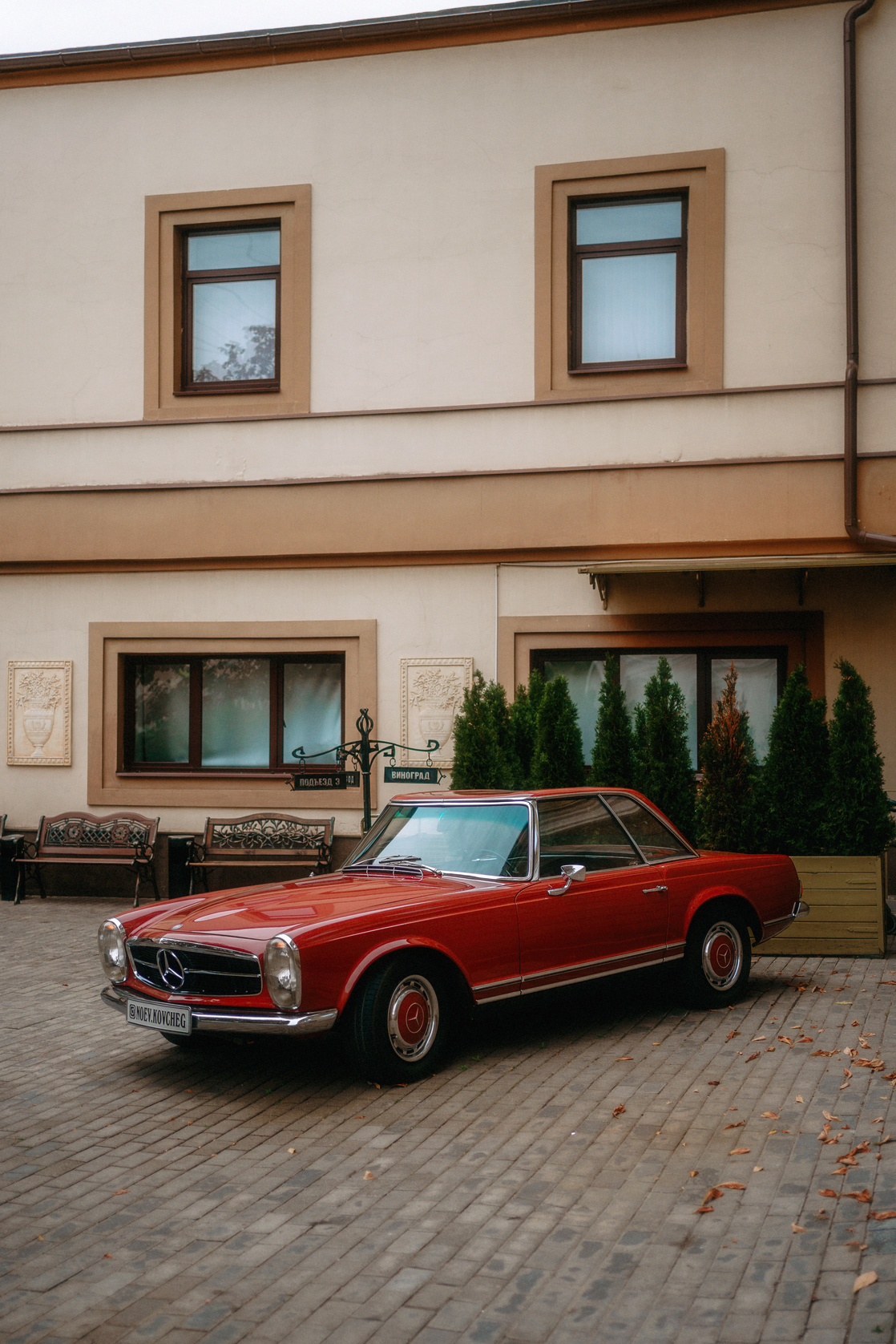 Old Red Mercedes Parked Near Building